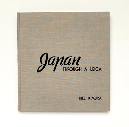 Book titled 'Japan Through a Leica' by Ihée Kimura on a white background